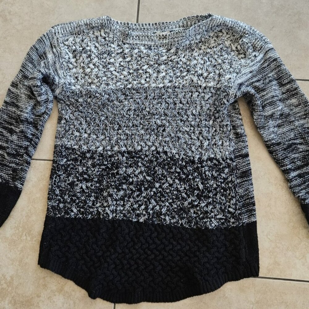 L Black and white pull over knit sweater with scoop bottom edge by It's our Time